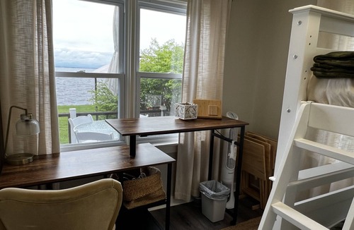 Bernhards Bay Cottage | Peaceful couples retreat on Oneida Lake. Insta-worthy views. Cozy interior.