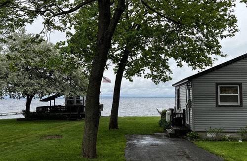 Bernhards Bay Cottage | Peaceful couples retreat on Oneida Lake. Insta-worthy views. Cozy interior.