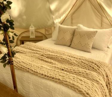 Gentry House | Peaceful Glamping Tents with Elevated Decks, Cozy Fire Pit, and Secluded Forest Views Near Gentry, AR