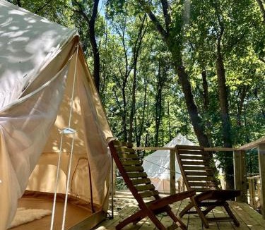 Gentry House | Peaceful Glamping Tents with Elevated Decks, Cozy Fire Pit, and Secluded Forest Views Near Gentry, AR