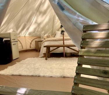Gentry House | Peaceful Glamping Tents with Elevated Decks, Cozy Fire Pit, and Secluded Forest Views Near Gentry, AR