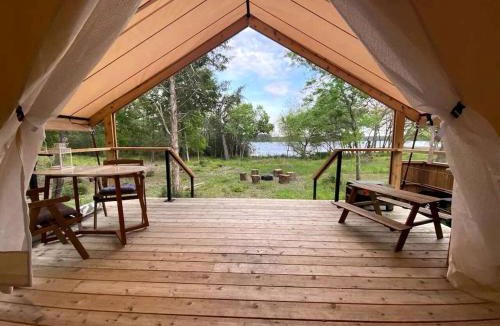 Bastrop House | Peaceful Lakefront Safari Tent with Fire Pit and Lake Views near Austin, Texas