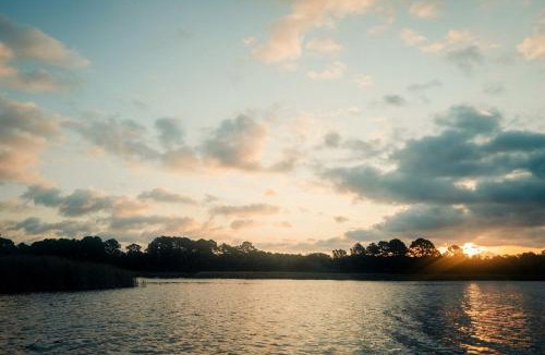 Bastrop House | Peaceful Lakefront Safari Tent with Fire Pit and Lake Views near Austin, Texas