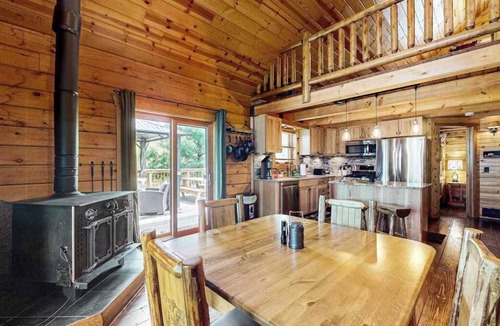 New Lisbon House | Peaceful log cabin with patio, gas grill, fire pit & WIFI
