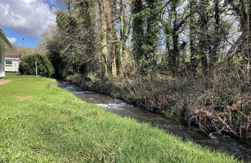 Liskeard House | Peaceful, streamside, detached bungalow - close attractions, walks & beaches
