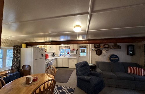 Fifty Lakes Cabin | Peaceful Vintage 1920's Lakefront Red Log Cabin