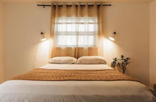 East Congress House | Peaceful Wabi-Sabi SoCo Stay with Workspace & Patio
