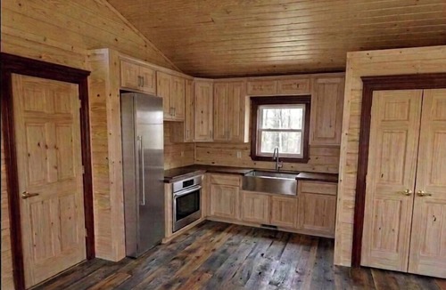 Pittsburg Cabin | Peaceful Wooded Getaway with Hot Tub, Fire Pit & Scenic Views in Pittsburg, Missouri