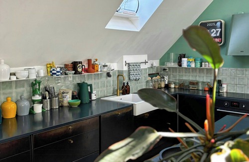 København V Apartment | Penthouse with plants and art near Kødbyen