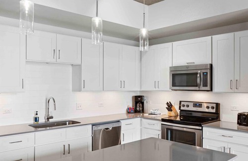 Civic District Apartment | Perfectly located Suite in Austin w/full kitchen, rooftop pool, fire pit, etc!