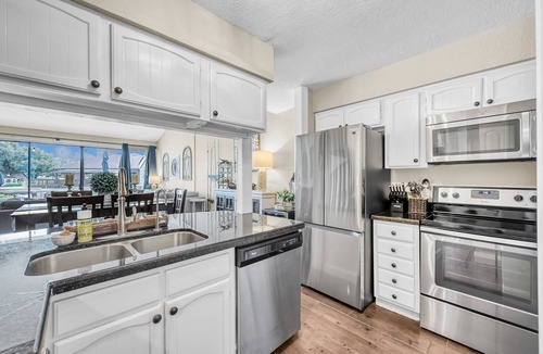 April Sound House | Pet Friendly 3BR Lakefront Condo with Patio Views, Swim Deck, & More!