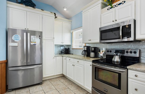 Whalehead Beach House | Pet friendly home! Elevator & amazing pool bar with TV, hot tub, deck views!