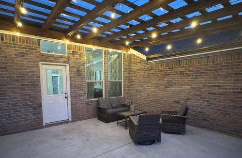 Wylie House | Pet Friendly Home with Relaxing Covered Patio and Private Backyard