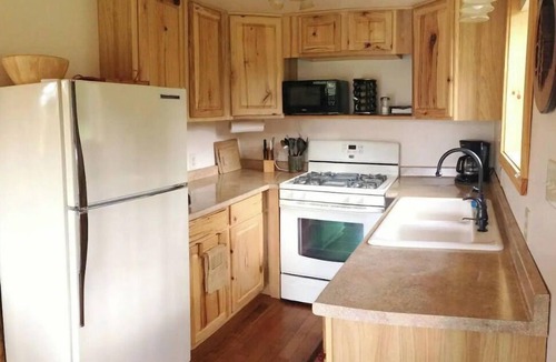 Port Angeles Cabin | Pond Cottage. A roomy tiny home with a Pond