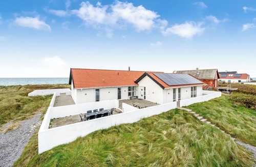 Lild Strand House | Pool and activity house with a 180-degree view of the North Sea, located at.