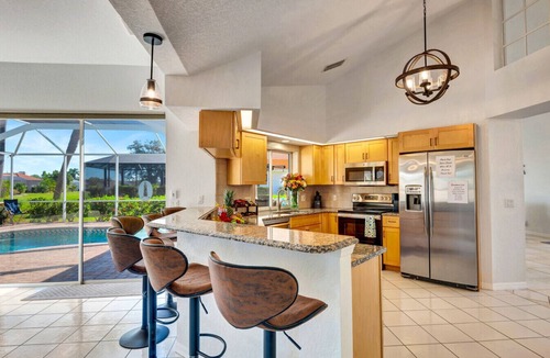 Broadmoor House | Pool + Game Room | Lanai & Canal View