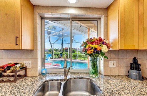 Broadmoor House | Pool + Game Room | Lanai & Canal View