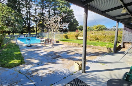 Kyneton Cottage | Pool room - tranquil spacious room with pool views.