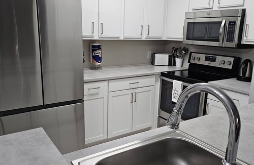 Clearwater Condo | Pool view, ground floor retreat!