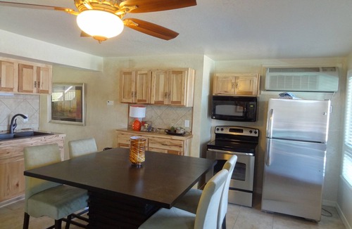 Mount Ida Cabin | Poolside King Cabana with full kitchen, king bed, sleeper sofa and pool access. by RedAwning