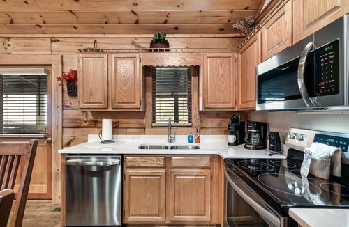 Pigeon Forge House | Porch w/swing & hot tub, sounds of stream, fireplace, pet & family friendly!