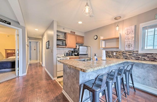Onekama Apartment | Portage Lake Condo with Deck and Pool Access!
