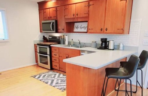 North Shore House | Private Cove + Dock, Kayaks, Paddleboards, Fire Pit, Pet-Friendly Lake Escape