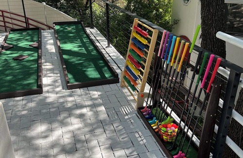 Oak Shores On Lake Austin House | Premium Lake Austin Lakeside Bedrooms. 6 Hole Mini Golf Course and Waterfall
