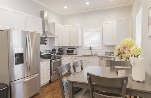 McFerrin Park House | Prime Location, Sleeps 10, 7 Beds, Cozy Front Porch and patio with Hot Tub