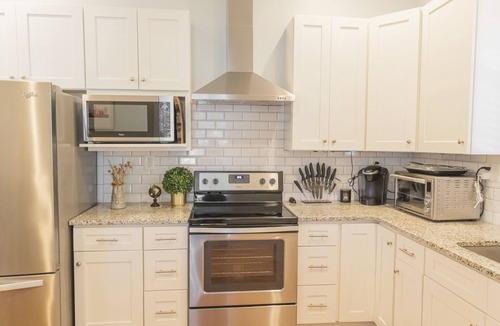 McFerrin Park House | Prime Location, Sleeps 10, 7 Beds, Cozy Front Porch and patio with Hot Tub