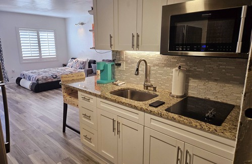 Southwest Orlando Condo | Prime Resort Studio near Universal & Disney balcony with LAKE VIEW