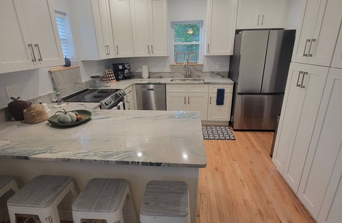 Maryville House | Pristine creekside home in peaceful Maryville with sprawling yard and deck.