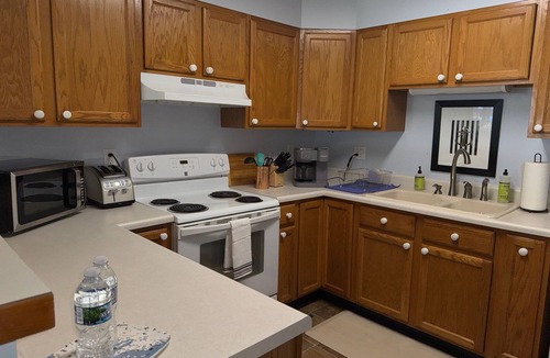 Onekama Apartment | Private beachfront 2BR w deck and firepit in Onekama