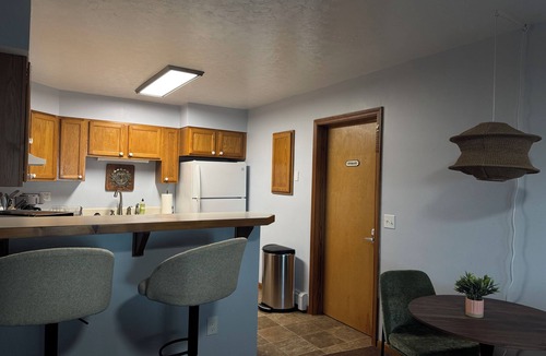 Onekama Apartment | Private beachfront 2BR w deck and firepit in Onekama