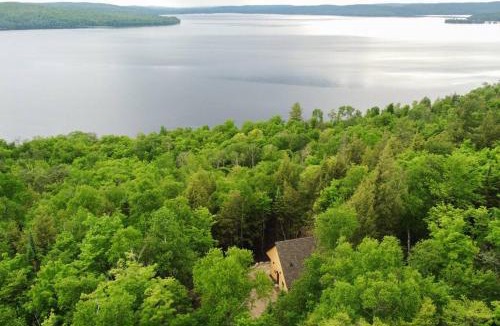 Madawaska Valley Ski Chalet | Private Cliffside Chalet Nestled in Nature With Western Sunsets & Waterfront Access Near Algonquin Park
