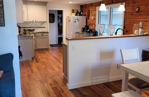 Town Bank House | Private forested log cabin steps from the Bay - pet friendly