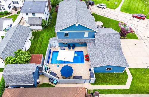 Huron House | Private heated pool in back & Sandy beach in front