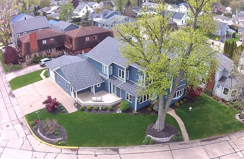 Huron House | Private heated pool in back & Sandy beach in front