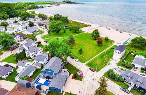 Huron House | Private heated pool in back & Sandy beach in front