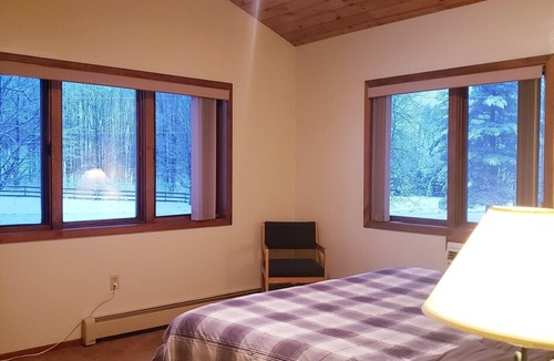 Ironwood Hotel | Private King Suite ideal for couples/romantic stays, and single travelers featuring a beautiful knotty pine vaulted ceiling. Dog friendly!