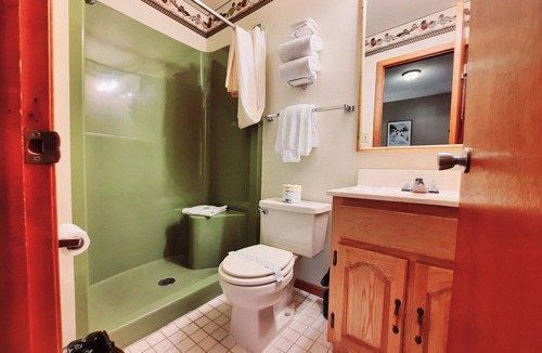 Ironwood Hotel | Private King Suite ideal for couples/romantic stays, and single travelers featuring a beautiful knotty pine vaulted ceiling. Dog friendly!