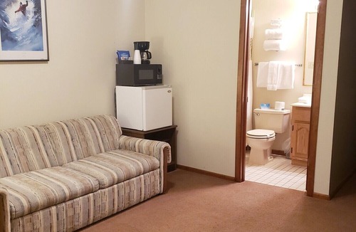 Ironwood Hotel | Private King Suite ideal for couples/romantic stays, and single travelers featuring a beautiful knotty pine vaulted ceiling. Dog friendly!