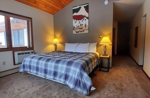 Ironwood Hotel | Private King Suite ideal for couples/romantic stays, and single travelers featuring a beautiful knotty pine vaulted ceiling. Dog friendly!
