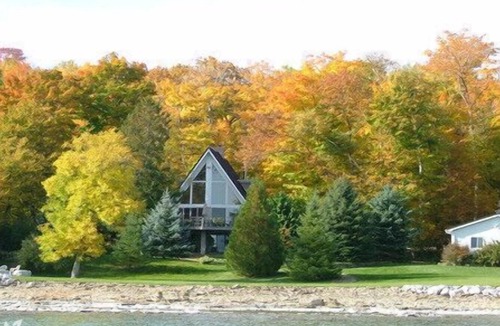 Big Bay House | Private waterfront home with fire pit on shore . perfect for family gatherings