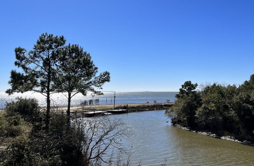 Kreole Cottage | Private Waterfront Retreat 3BD/4BA Hot Tub 2 Boat Docks & Relaxing Coastal Views
