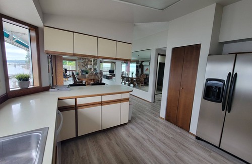 Belfair House | Quaint beachfront home with bulkhead and swim float.