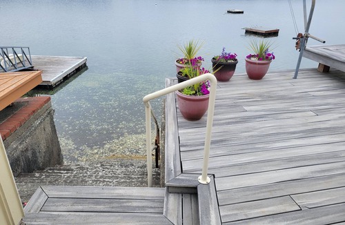 Belfair House | Quaint beachfront home with bulkhead and swim float.