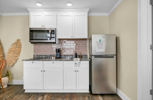 Safety Harbor Hotel | Queen bed, kitchenette, living room/couch.