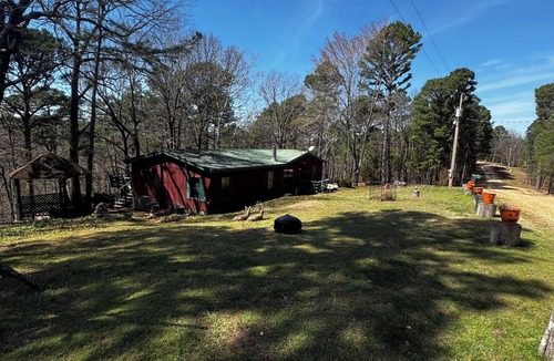 Flint Creek House | Quiet cabin in the woods w/access to pools, river, & lakes in gated community!