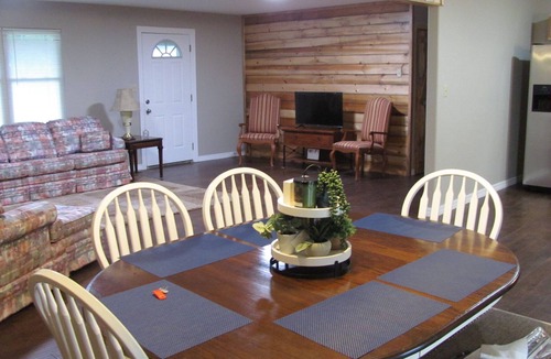 Atkins House | Quiet neighborhood with covered patio & plenty of space for family and friends!